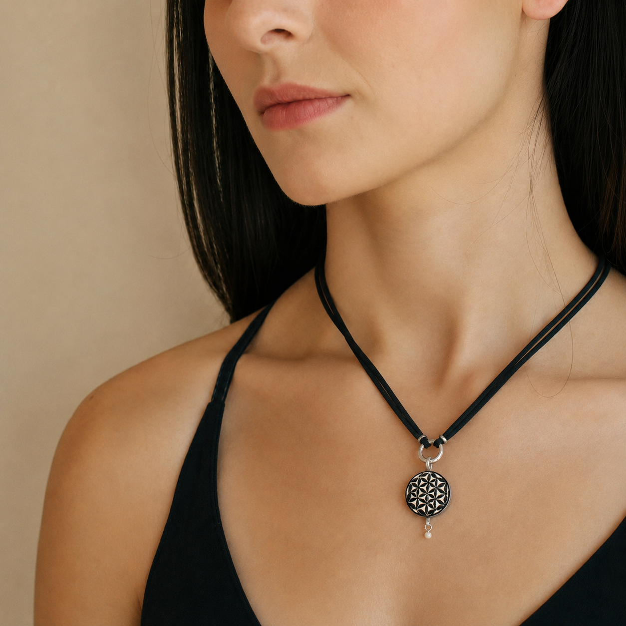Close-up of Flower of Life geometric ostrich eggshell pendant