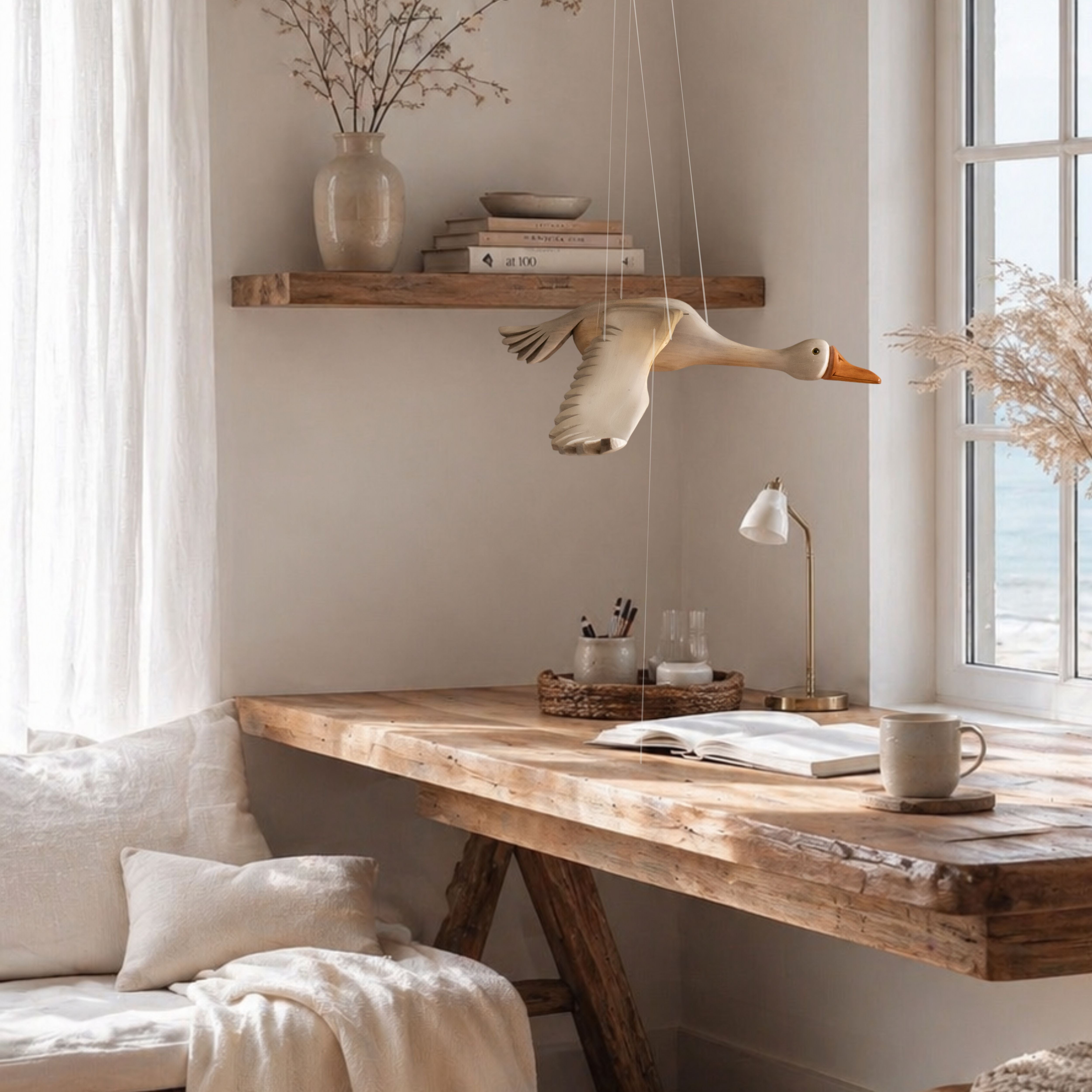 Hand carved mobile wooden goose in a Scandinavian study