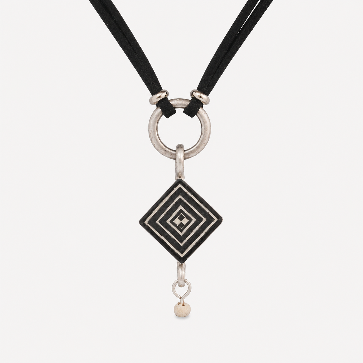Handcrafted petite geometric ostrich eggshell pendant necklace with layered design, black suede cord and stainless steel findings.